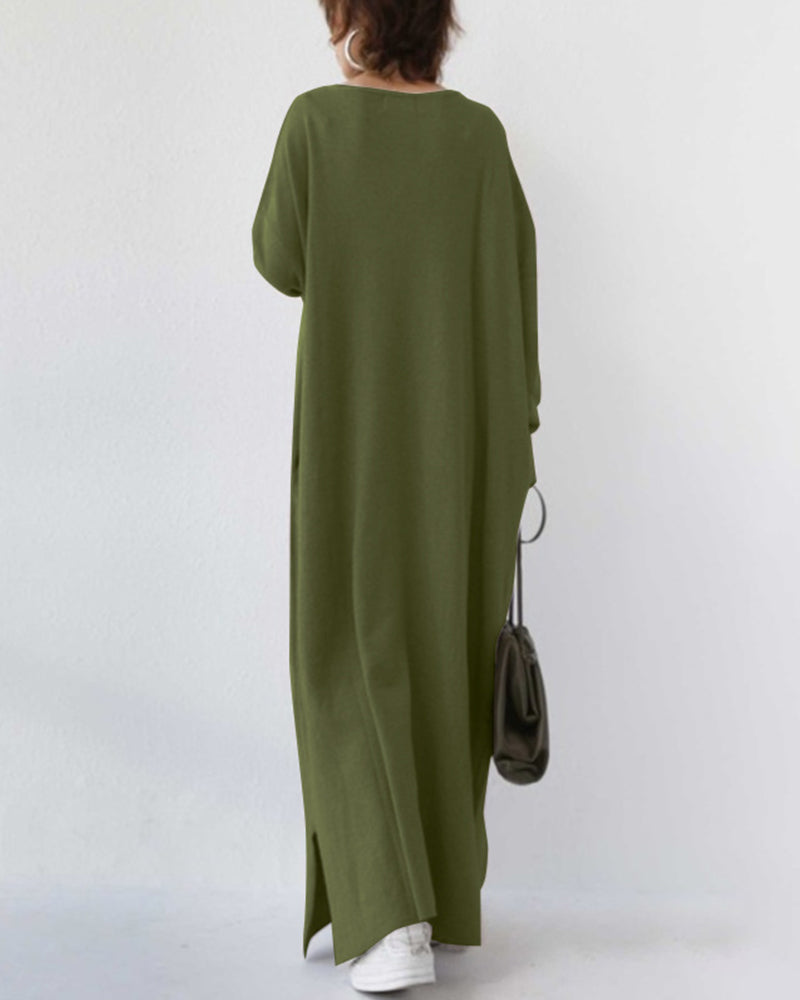 Stylish women's winter maxi dress with flowing long sleeves, an elegant and comfortable seasonal fashion.