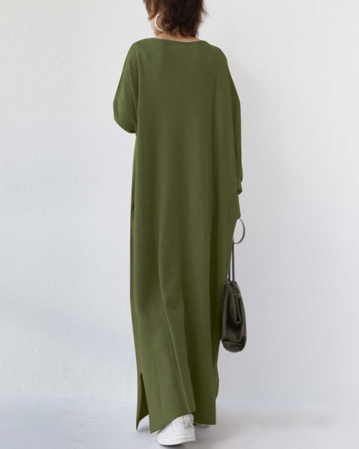 Stylish women's winter maxi dress with flowing long sleeves, an elegant and comfortable seasonal fashion.