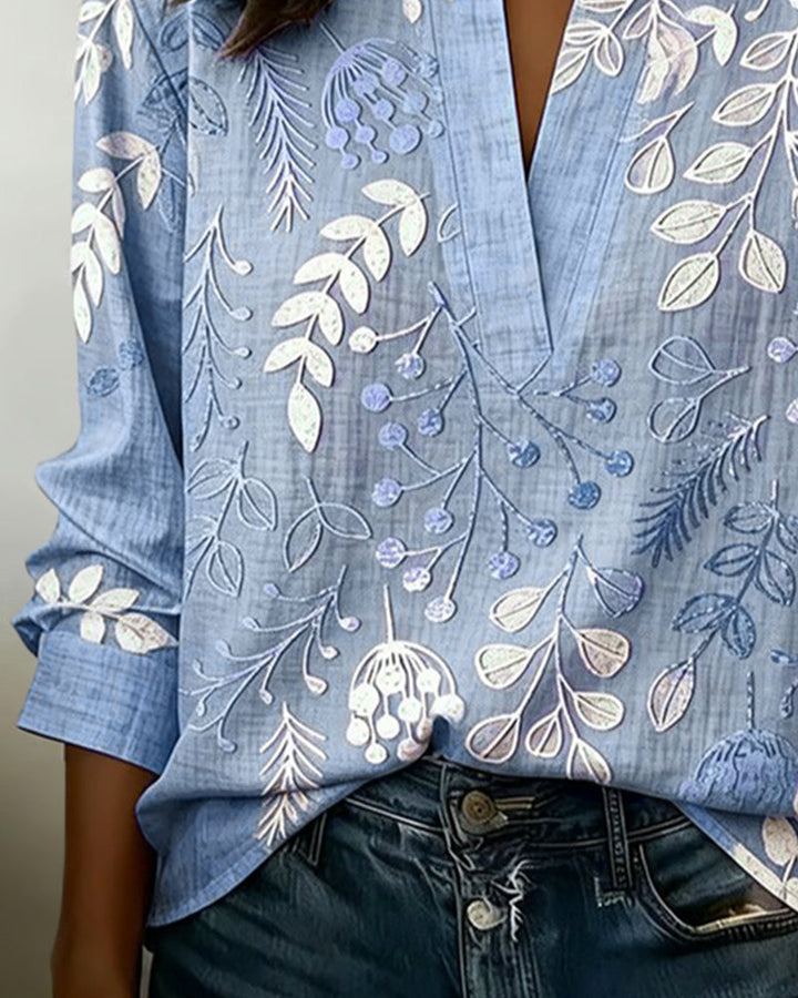 Versatile Women's Blouse: Pastel floral print, V-neck, showcasing spring and summer trends.