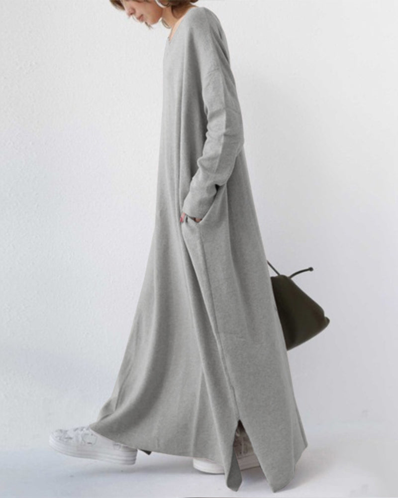 Full-length women's elegant winter maxi dress, featuring long flowing sleeves for seasonal comfort.