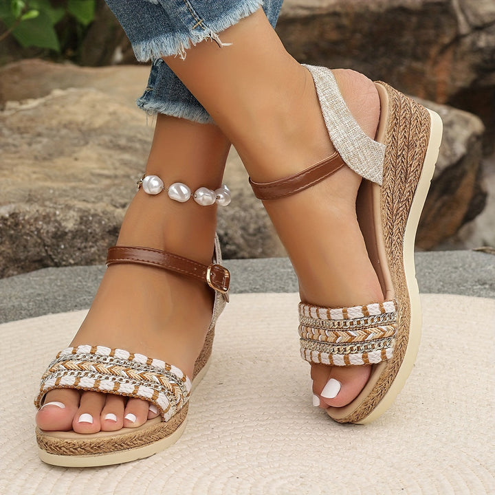 Fashionable women's platform wedge sandals for summer, offering comfort with crossed straps.