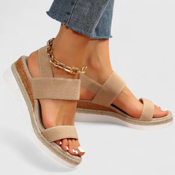Detailed shot of the comfortable wedge heel on women's orthopedic sandals, for stable walking.