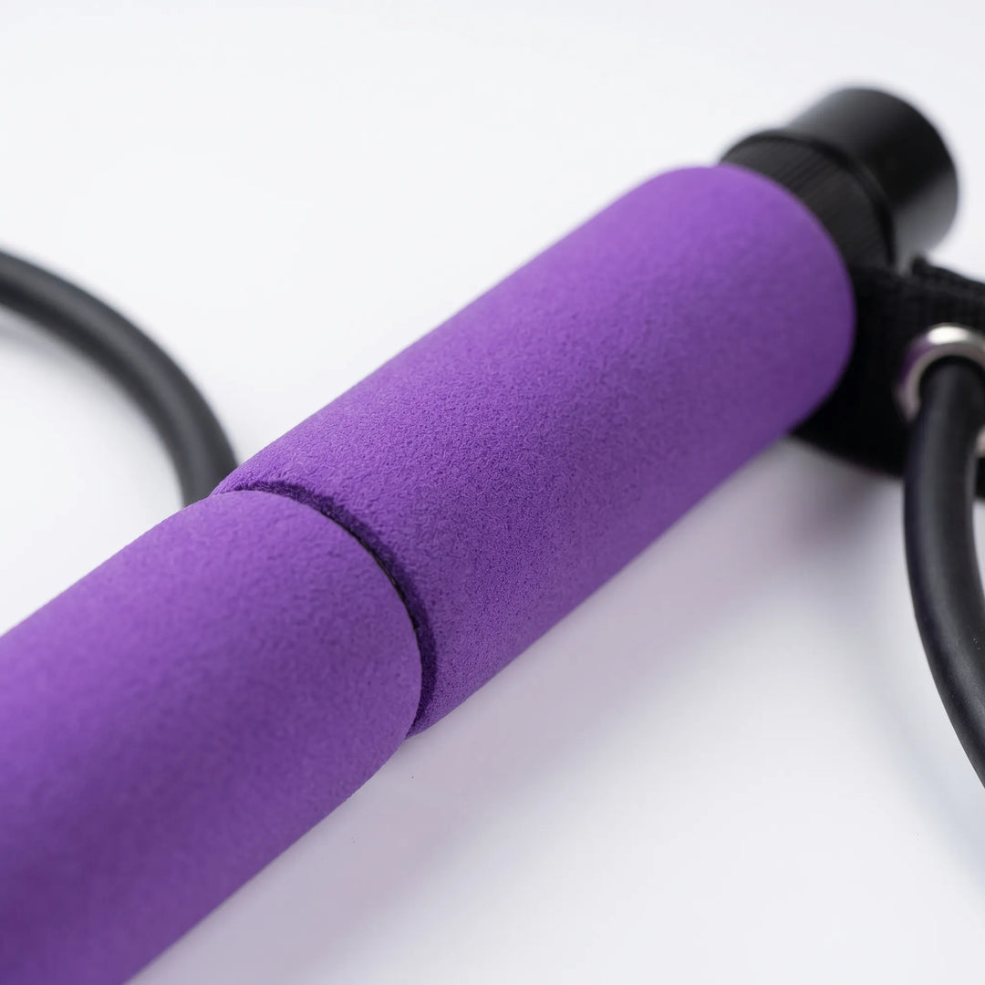 Portable Pilates exercise stick for full body workouts, yoga & fitness. Integrated resistance bands.