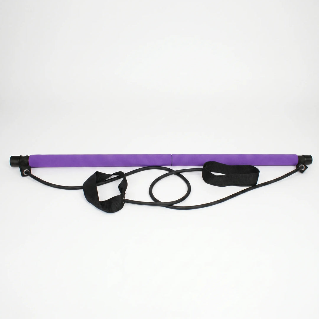 Compact Pilates stick with resistance bands for full body exercise. Perfect portable fitness equipment.
