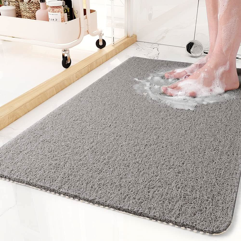 Universal non-slip shower mat with hygienic drainage, enhancing bathroom safety & modern decor.