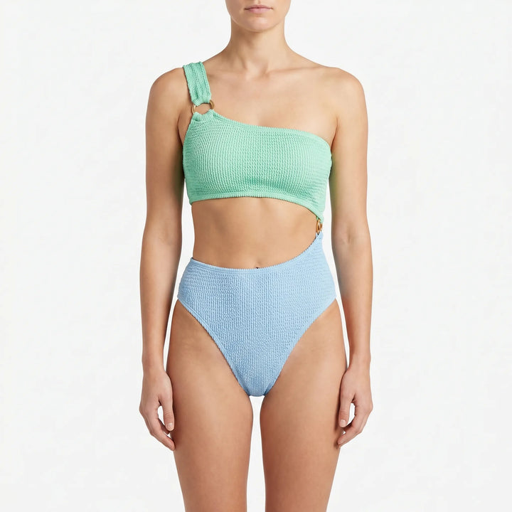 Women's sleek asymmetric monokini swimsuit with daring cut-outs, perfect for modern beach fashion.