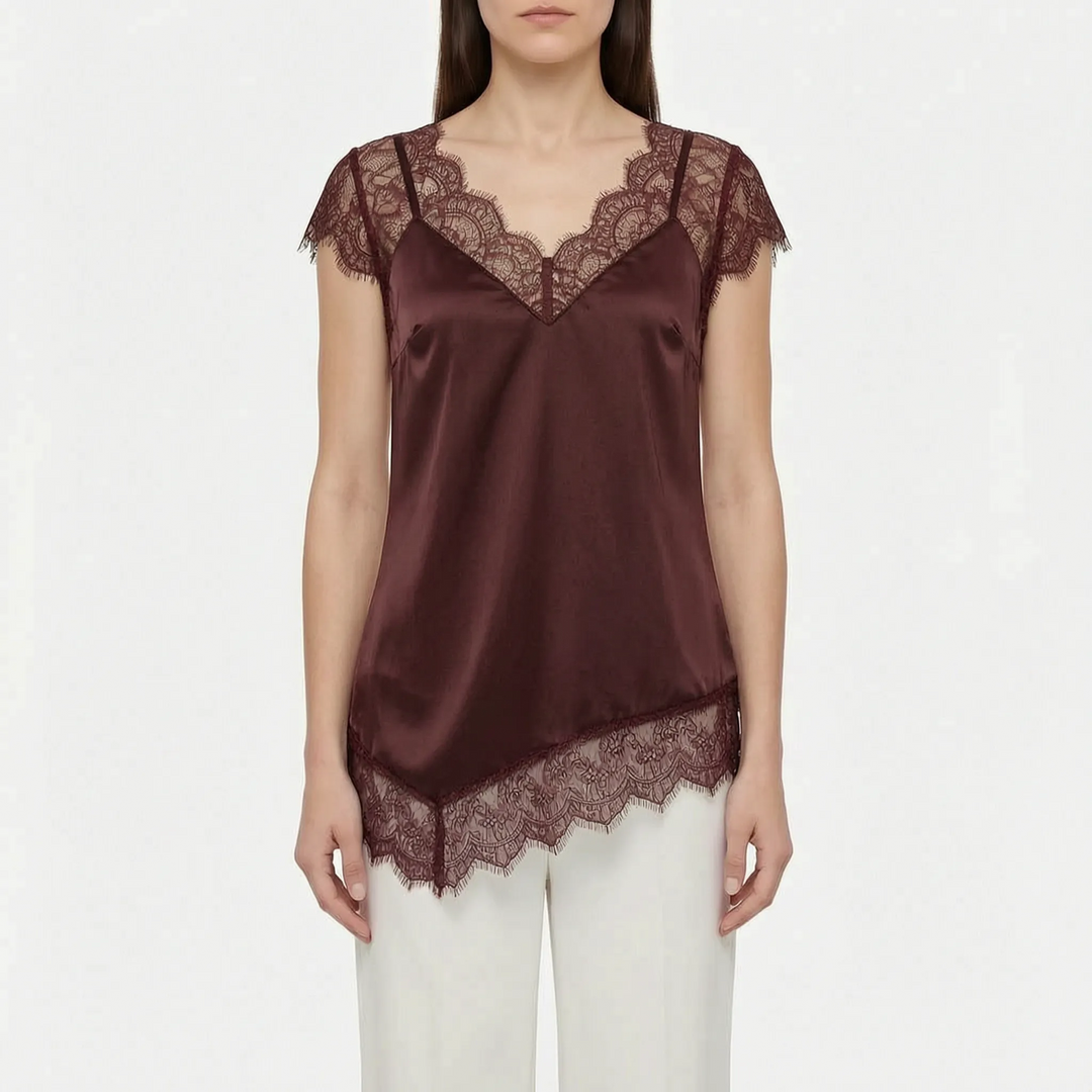 Chic women's sleeveless asymmetrical top with sheer details & unique design. Ideal elegant party wear blouse.