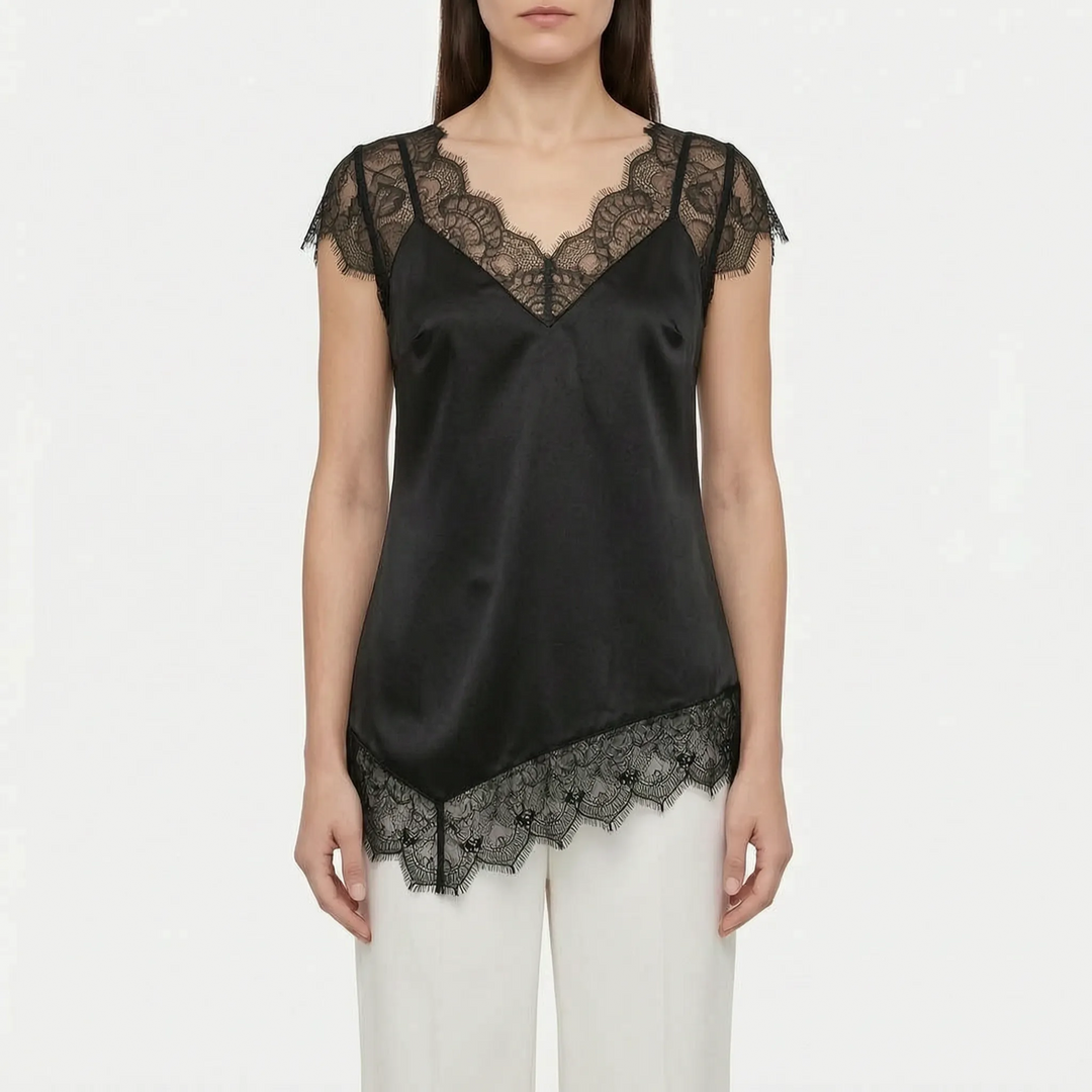 Modern women's elegant asymmetrical top, sleeveless with sheer details. A chic and versatile evening blouse.