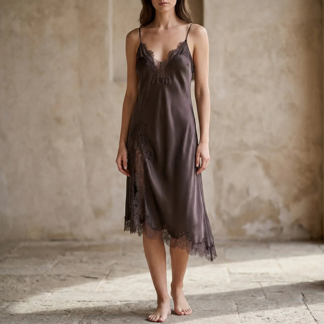 Women's asymmetrical V-neck slip dress with openwork trim. Elegant for evening & party occasions.