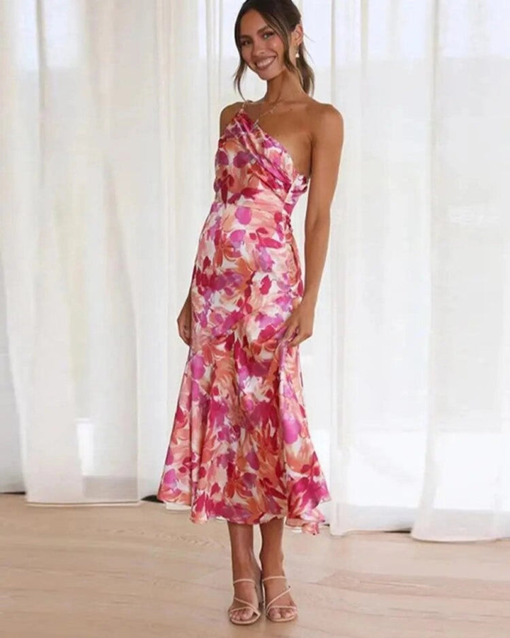 Elegant women's floral midi dress with an asymmetric hem, perfect for summer occasion wear.