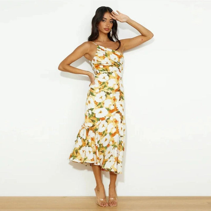 Occasion wear: women's flowing floral midi dress, sleeveless and chic asymmetric design.