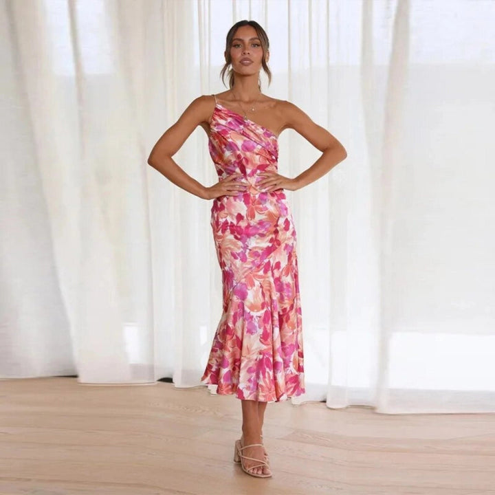 Feminine sleeveless floral midi dress for women, with a graceful flowing asymmetric cut.