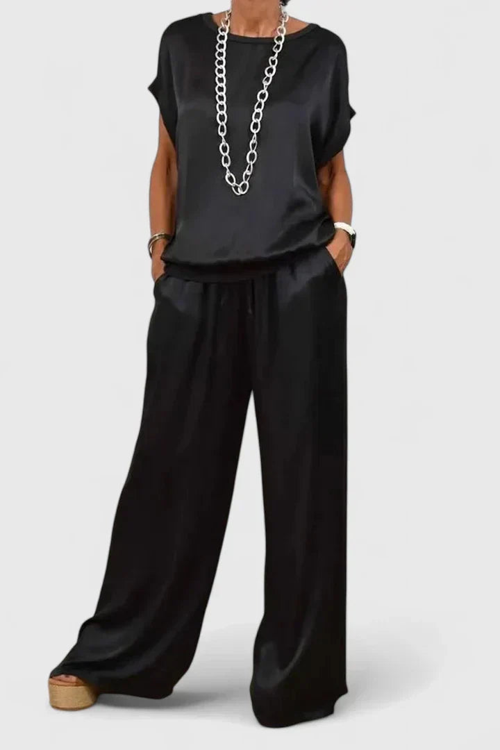 Elegant women's batwing top & wide leg trouser two-piece set in a chic solid color for smart casual or evening wear.
