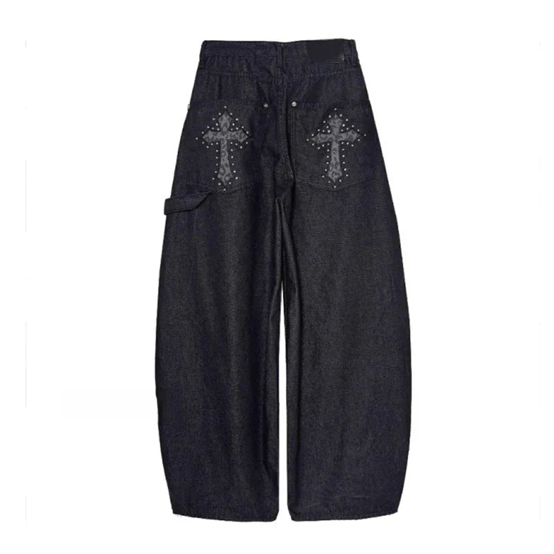 Statement women's baggy wide-leg pants in black, showcasing a studded cross detail. Essential for punk rock style.