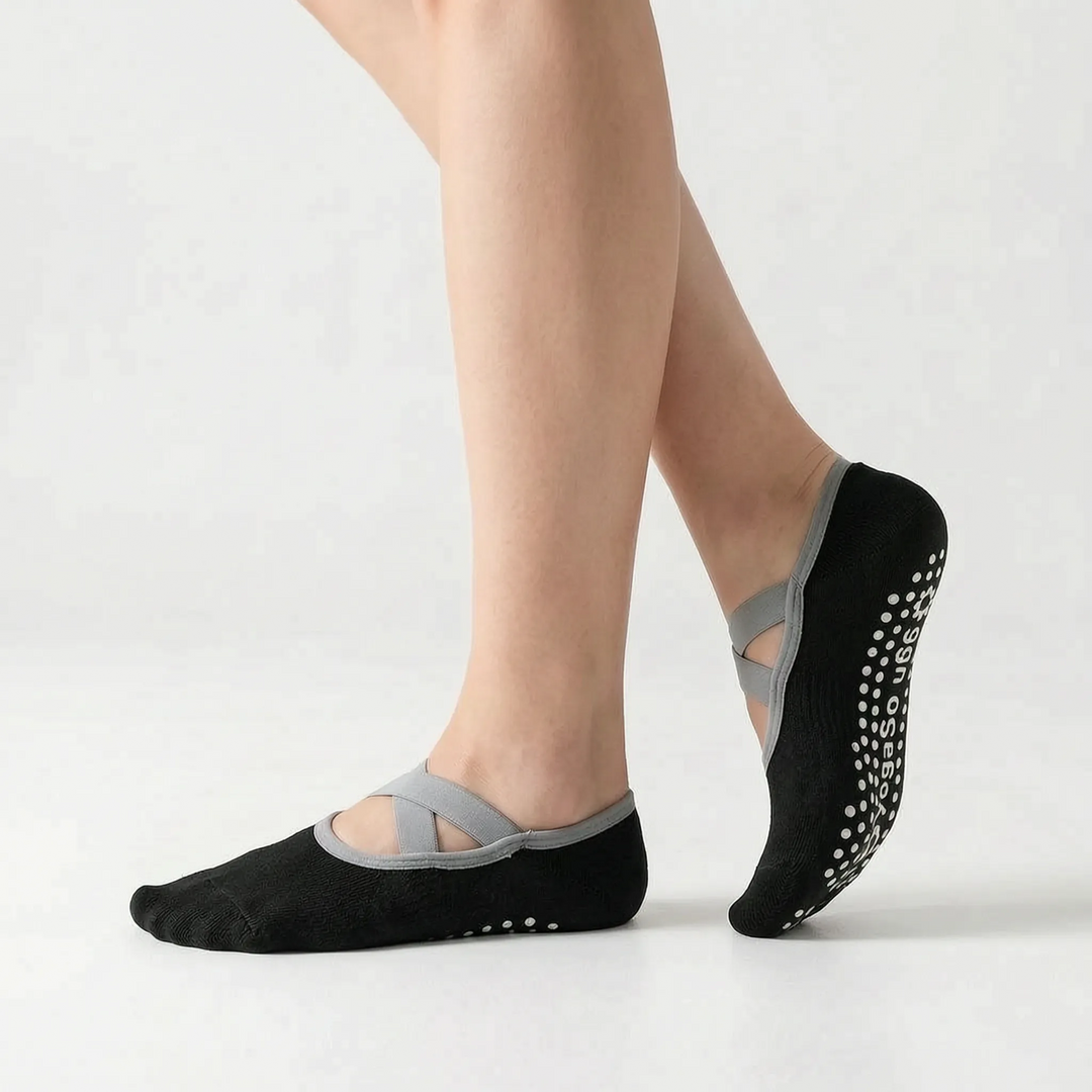 Women's green activewear grip socks, essential non-slip footwear for studio sports, yoga & pilates.