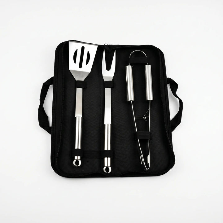 Durable stainless steel BBQ tool set featuring long handles for safe and easy outdoor grilling, includes spatula, tongs, fork.