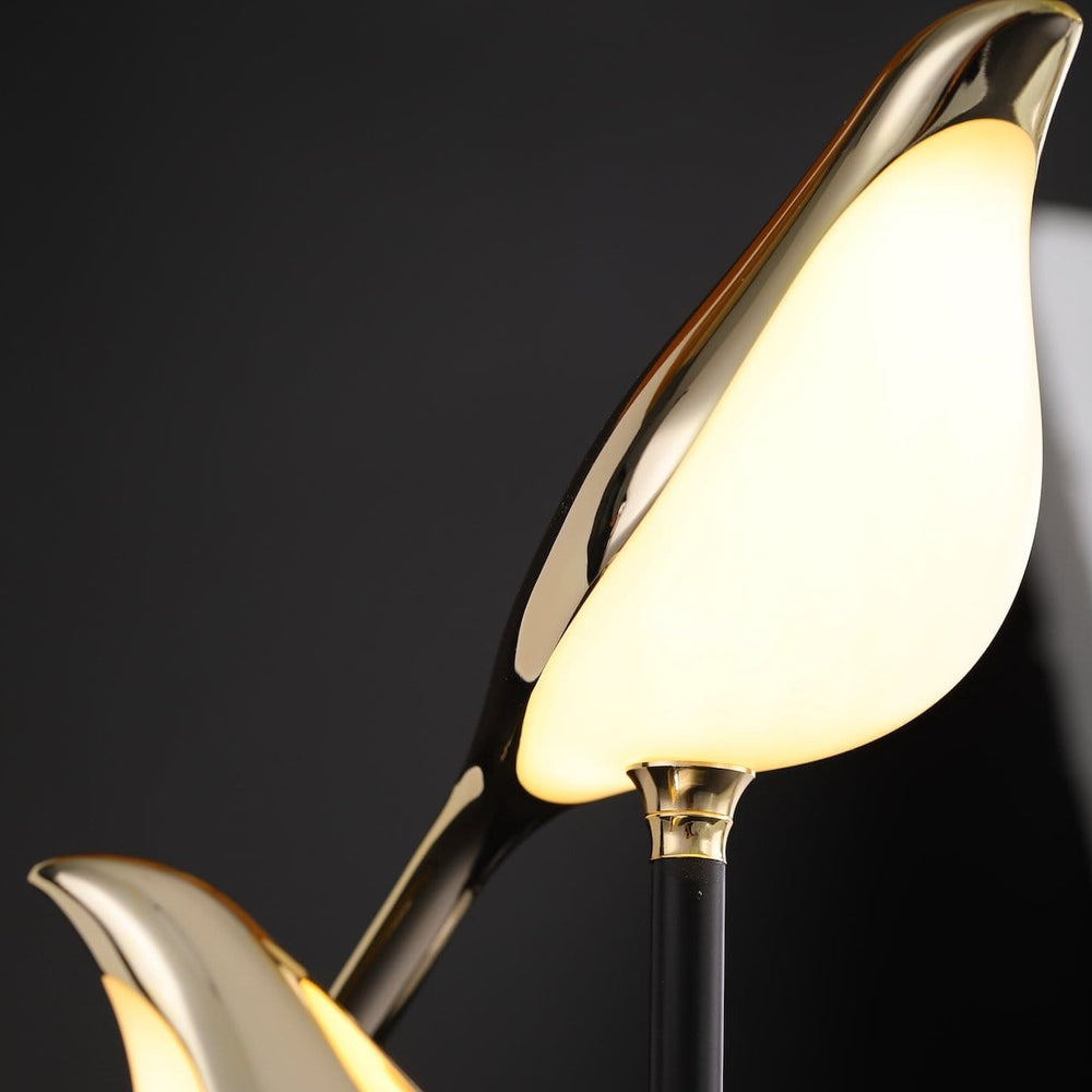 Scandinavian gold avian LED wall lamp. Artistic bird light for modern living rooms and elegant interiors.