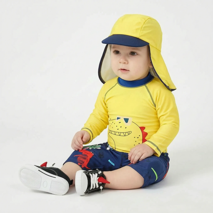Sun protective boys' cartoon print swim set. UPF 50+ kids' swimwear with matching hat for beach & pool.