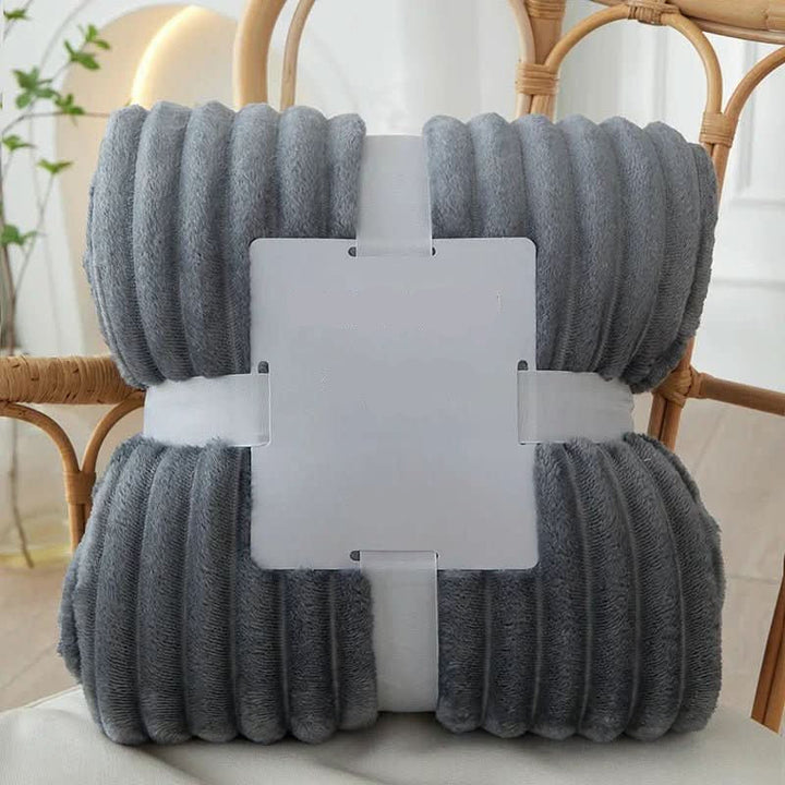 Plush flannel fleece throw blanket, providing ultimate soft comfort and cozy warmth for relaxation.