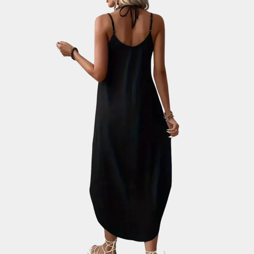 Sleeveless V-neck cami dress for women, elegant black summer wear, offering a flowy and comfortable silhouette.