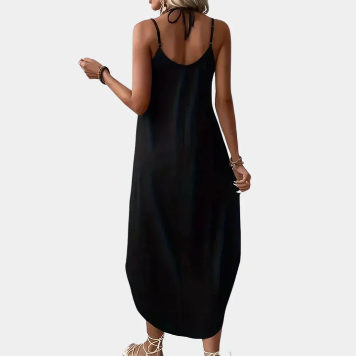 Sleeveless V-neck cami dress for women, elegant black summer wear, offering a flowy and comfortable silhouette.