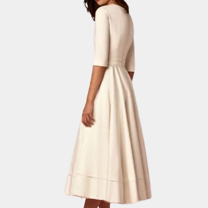 Flowy women's A-line midi dress. Sleeveless, with an elegant side slit, perfect for a chic spring or summer look.