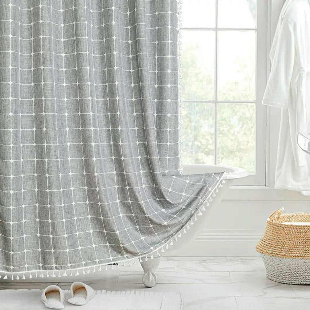 Close-up of elegant tassels on a Bohemian Farmhouse shower curtain, showcasing rustic texture & detailed design.