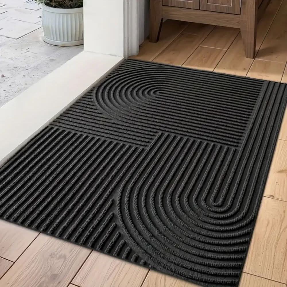 Absorbent washable entryway mat with modern flowing line design. Perfect non-slip floor mat for home decor.