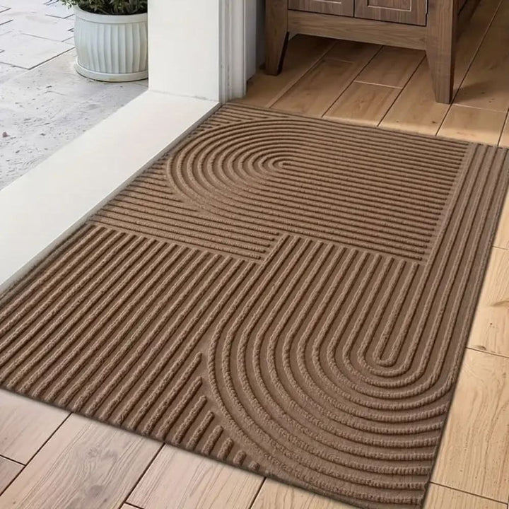Washable mudroom mat, highly absorbent with elegant flowing lines. Non-slip doormat for pet-friendly homes.