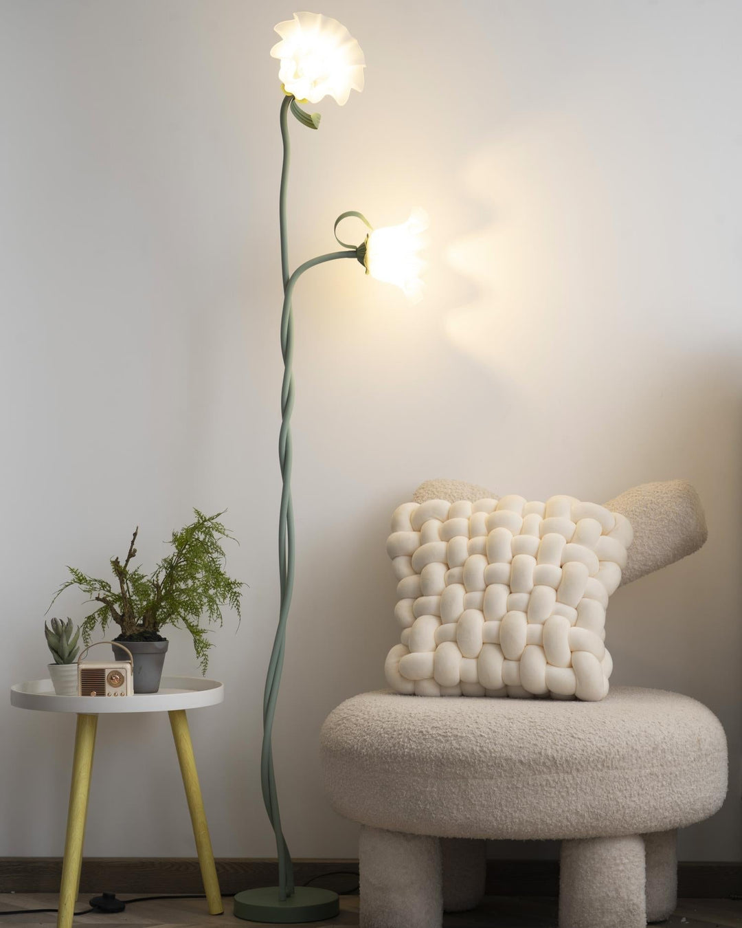 Modern botanical floor lamp, green floral pattern, elegant white shade, ambient.