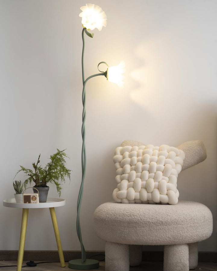 Modern botanical floor lamp, green floral pattern, elegant white shade, ambient.