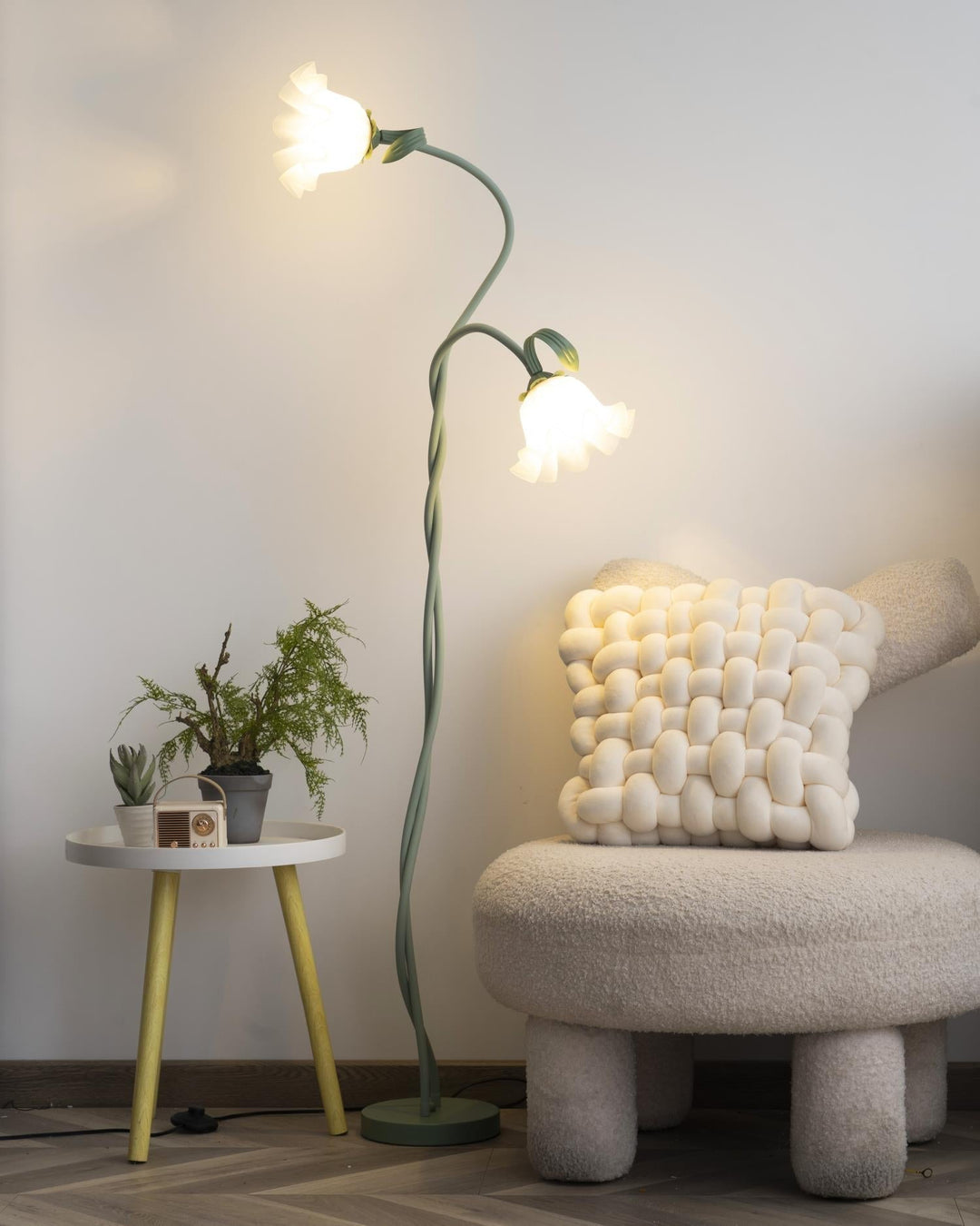 Green floral floor lamp, contemporary design, white shade for soft, decorative light.