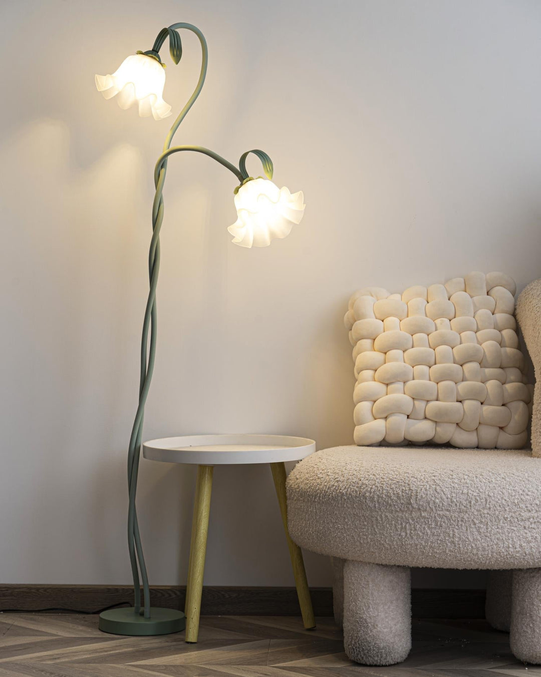 Stylish green floral floor lamp with a modern base and a contrasting white shade.