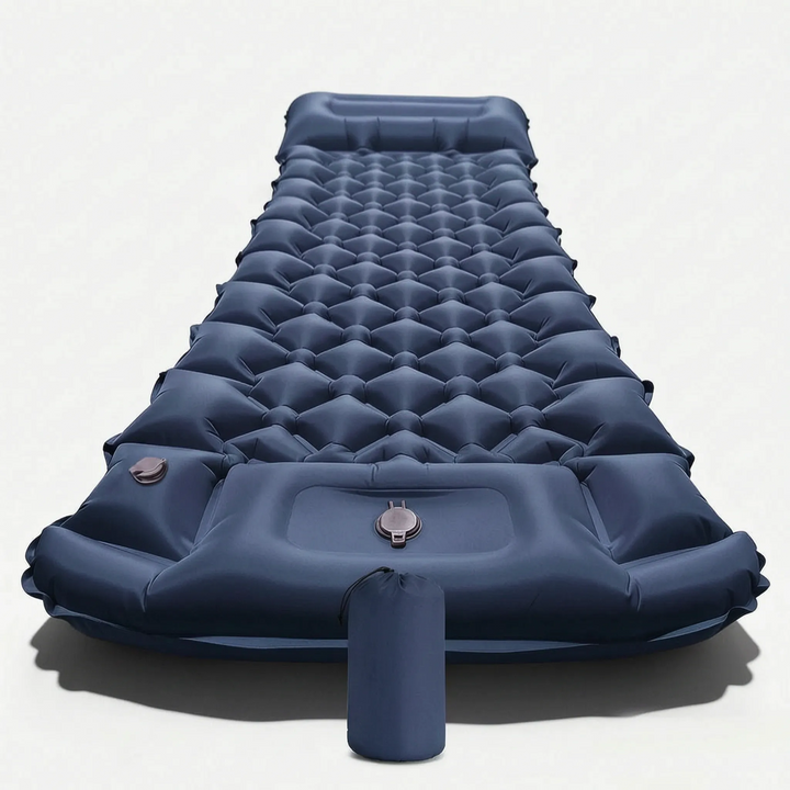 Durable, comfortable surface of an inflatable camping sleeping mat & integrated pillow, essential outdoor gear.