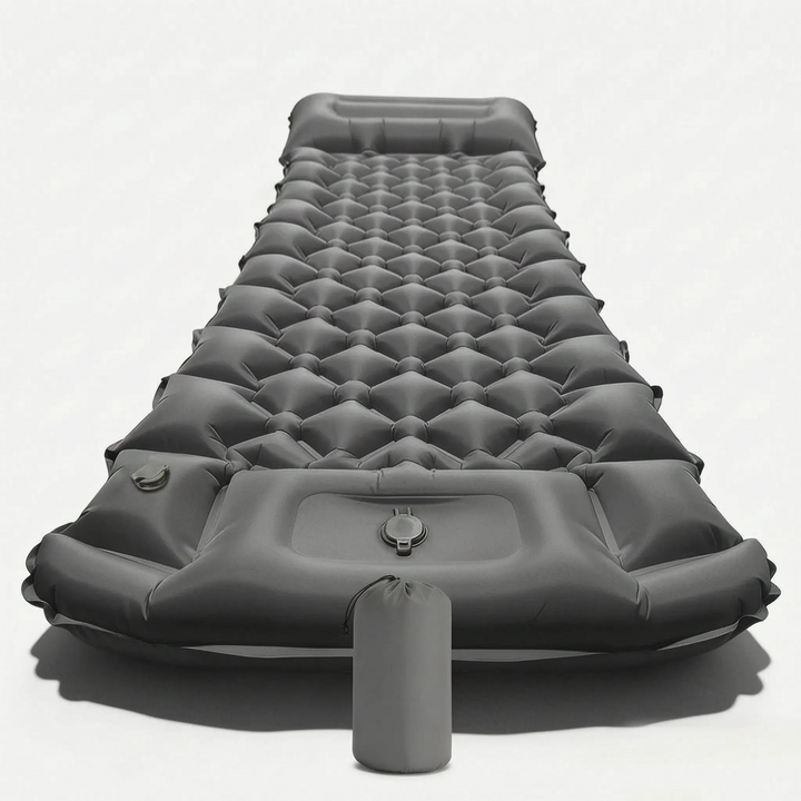 Ergonomic inflatable camping mat with an integrated pillow, providing support for outdoor sleeping comfort.