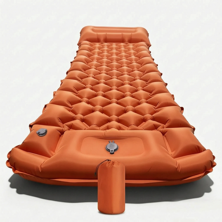 Compact inflatable camping sleeping mat & pillow, packed with backpack gear for a lightweight hiking trip.
