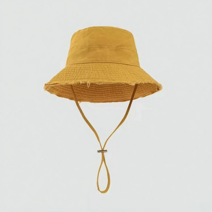 Women's versatile bucket hat, adjustable chin strap, frayed brim. Ideal summer, beach, travel sun protection.
