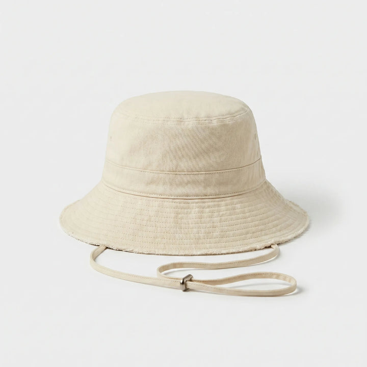Stylish women's solid color bucket hat, great for travel, outdoor activities, or a casual summer look.