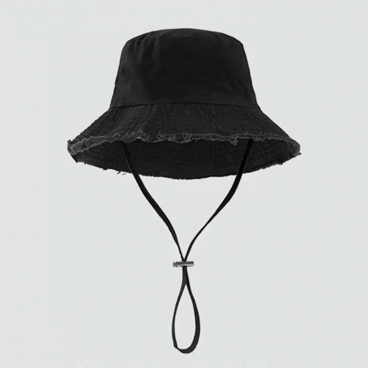 Women's adjustable bucket hat with chin strap, perfect for outdoor adventures, keeping sun off.