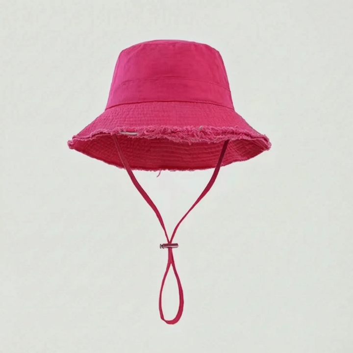 Trendy women's travel bucket hat, solid color design with an adjustable strap for comfortable wear.