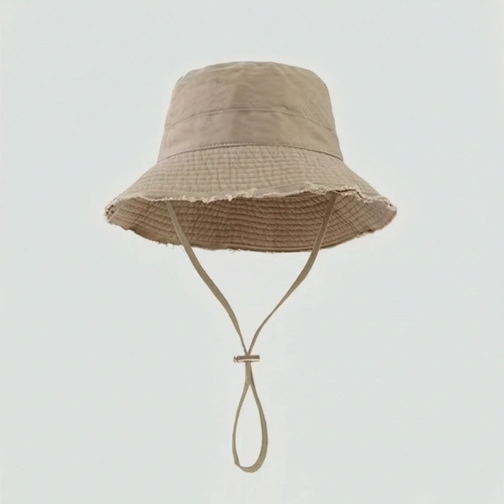 Women's beach bucket hat, solid color, offering excellent sun protection with an adjustable chin strap.