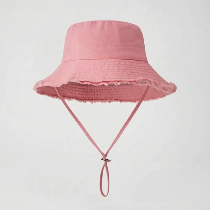 Fashion-forward women's outdoor bucket hat with adjustable chin strap, perfect for sunny days.