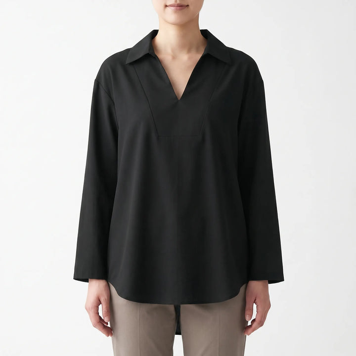 Versatile women's solid color high-low tunic top. Long sleeve, v-neck, relaxed fit blouse for casual fashion.