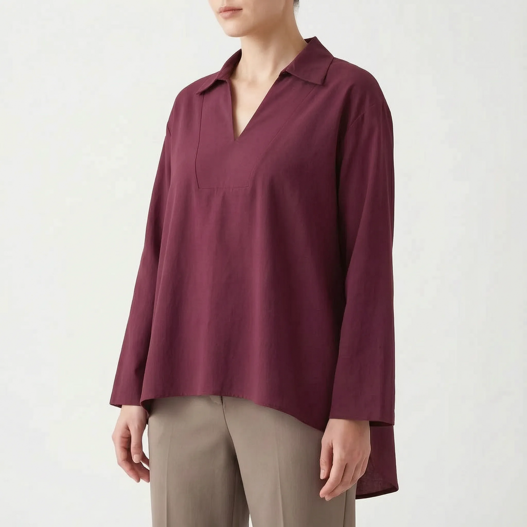 Effortless women's v-neck casual tunic. Long sleeve, high-low hem top in a relaxed fit for daily fashion.