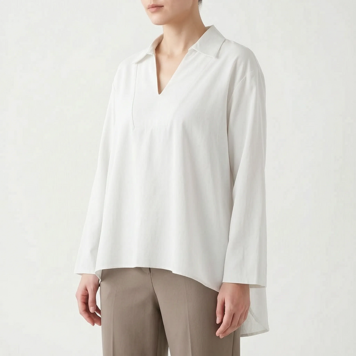 Solid color women's high-low tunic blouse. V-neck, long sleeve, relaxed fit, casual top for versatile styling.