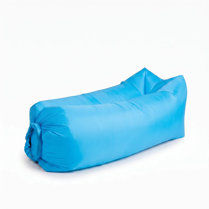 Comfortable unisex inflatable air lounger used for ultimate outdoor relaxation in a scenic spot.