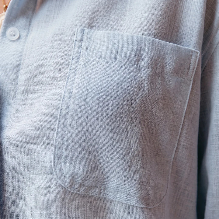 Versatile women's long-sleeve button-up blouse, ideal for spring or fall casual fashion.