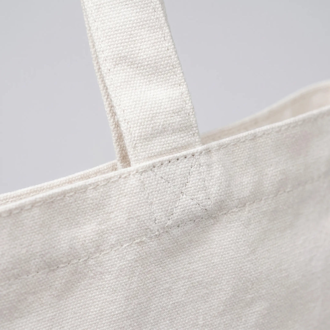 Reusable women's printed shopping tote bag, eco-friendly & stylish for groceries or market.