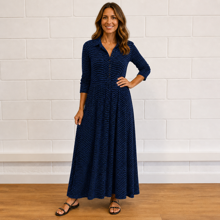 Flowy women's printed maxi dress with long sleeves and button-front. Comfortable and elegant for casual or daily wear.