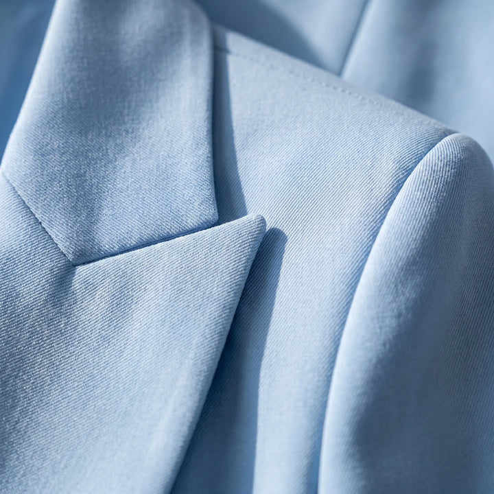 Stylish women's tailored blazer and straight-leg trousers. Perfect business suit for a modern professional look.